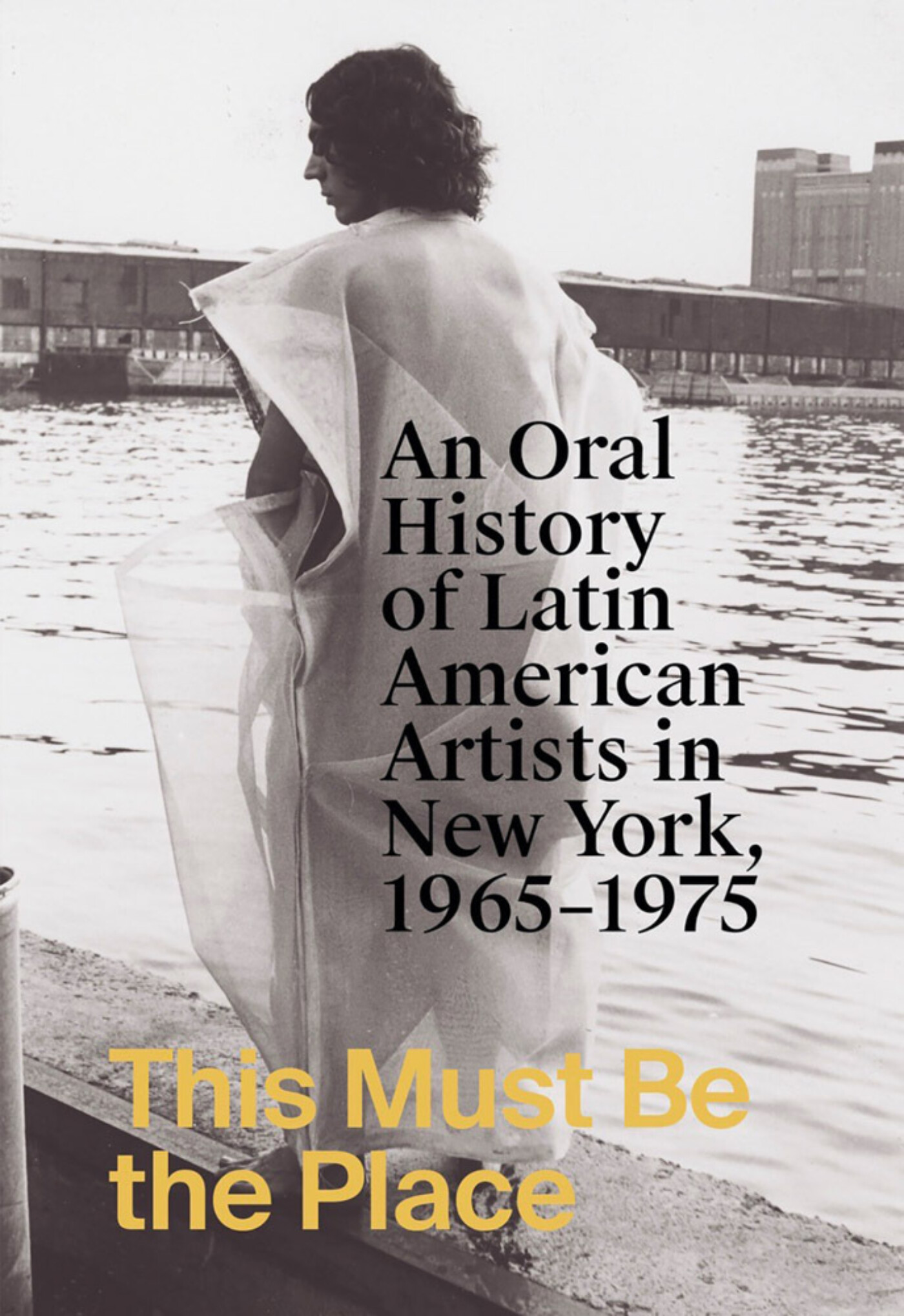 Cover image including typography of the book's title, along with a full-bleed image of an Helio Oiticica work from 1972. The photograph features a figure standing barefoot at the New York Chelsea Piers, wearing one of Oiticica's "parangole," tactile artworks meant to be activated by their wearer.