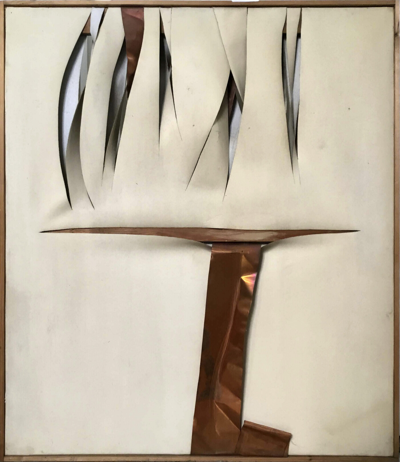 A square-formatted canvas has several vertical cut-lines on its upper register, revealing the empty space of the wall through the resulting jagged slits. At the bottom register, an L-shaped piece of copper metal reflects light.