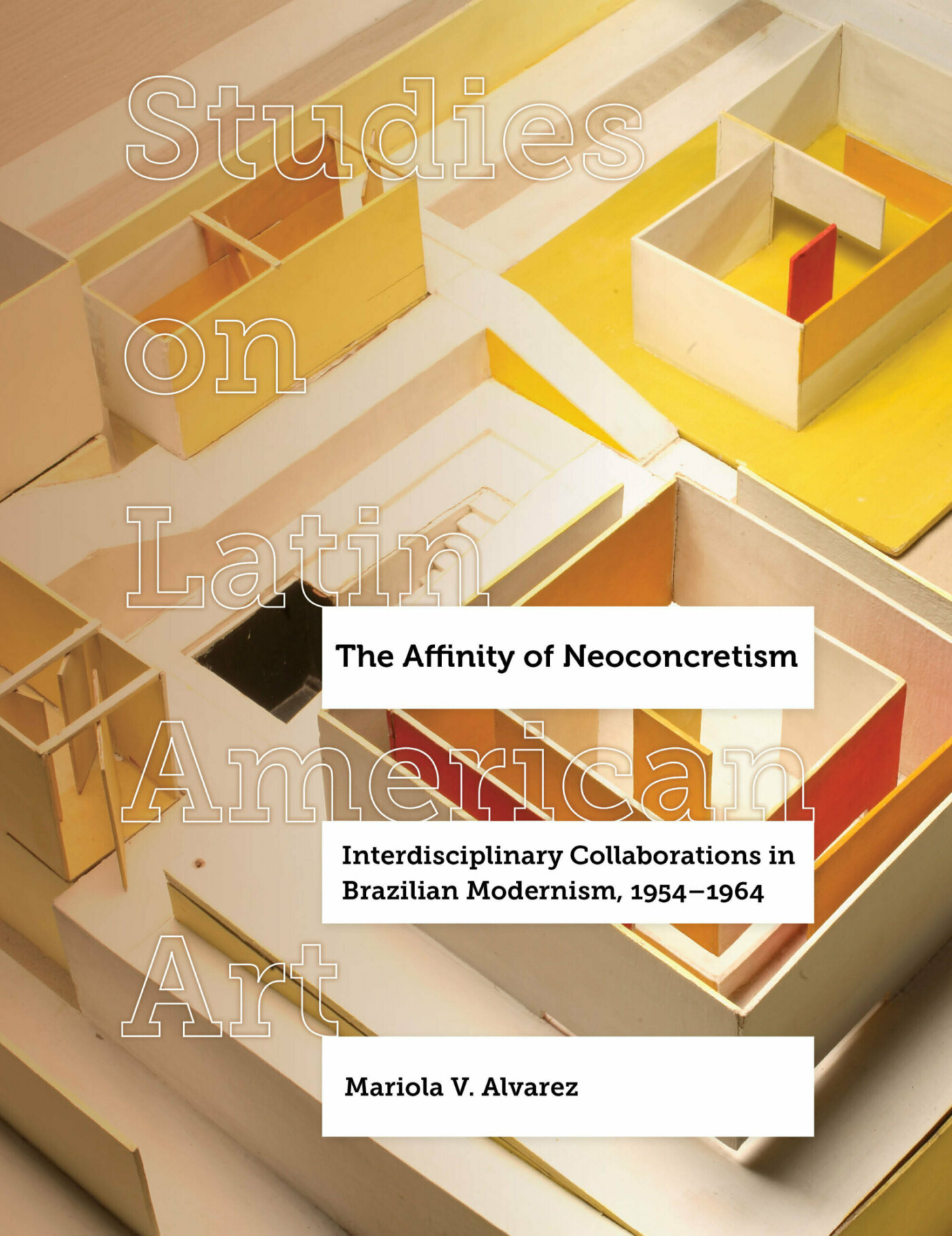 Book cover showing a maquette of an exhibition space with portions of vivid yellow and pink modeling board. Overlay text shows the title of the book and the name of the series, Studies on Latin American Art.