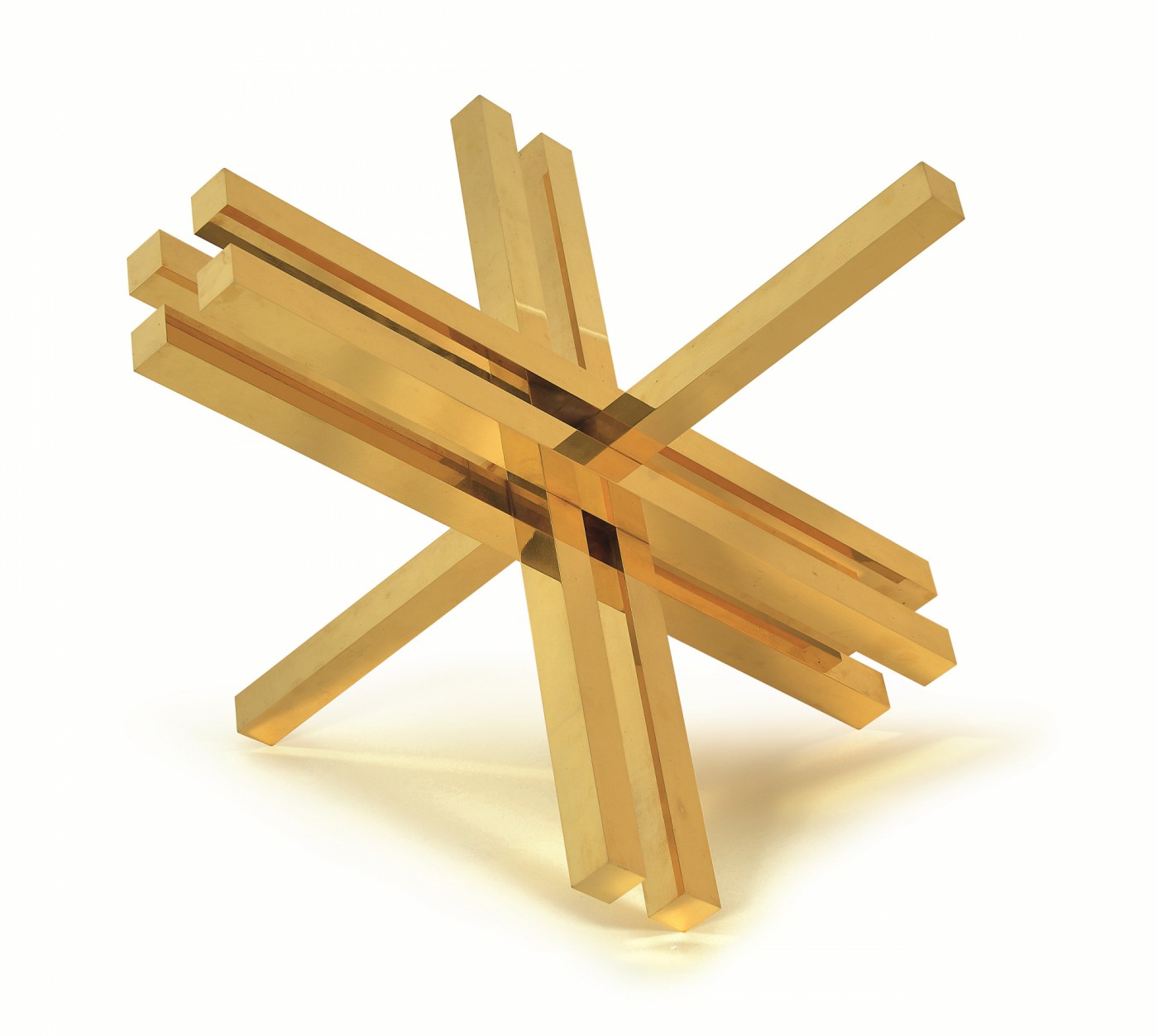 Image of a geometric brass sculpture by Max Bill.